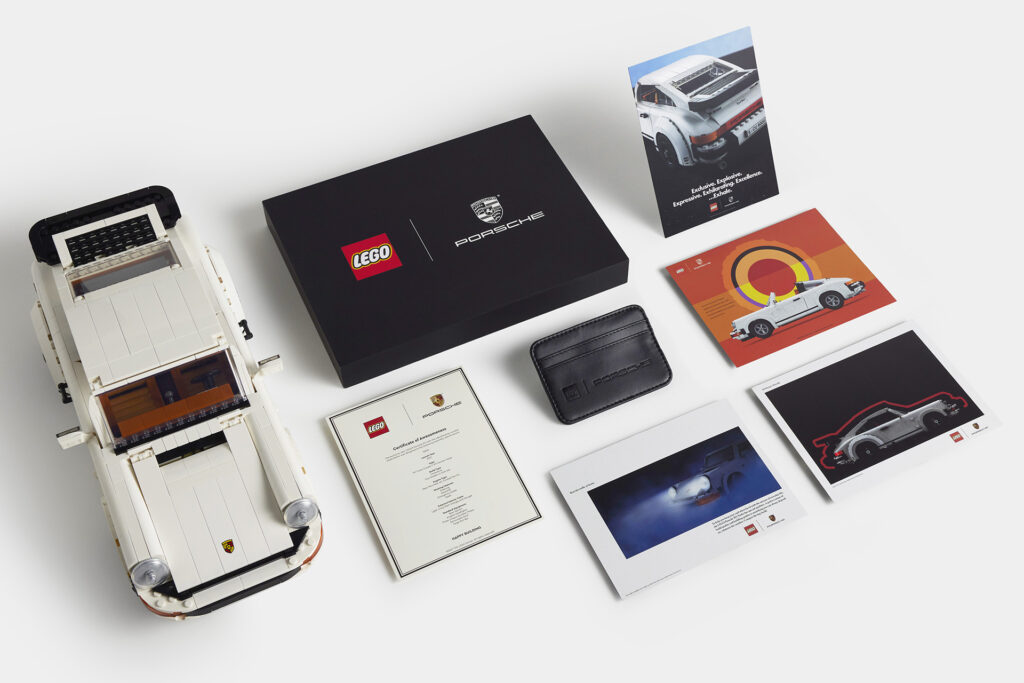 Everything included in the limited owner's pack with the new LEGO Porsche set 10295. The owner's pack includes a certificate of awesomeness, prints of recreated vintage Porsche 911 advertisements, and a LEGO Porsche card wallet.