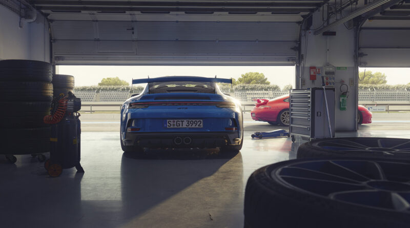 2022 Porsche 911 GT3 rear view from within a race track garage