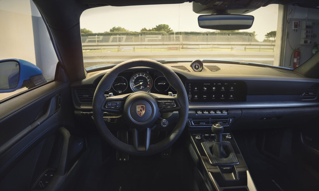 2022 Porsche 911 GT3 interior view featuring the multi-function steering wheel