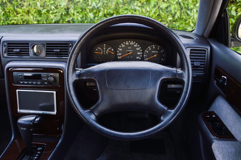 Black 1995 Nissan Gloria sedan steering wheel
