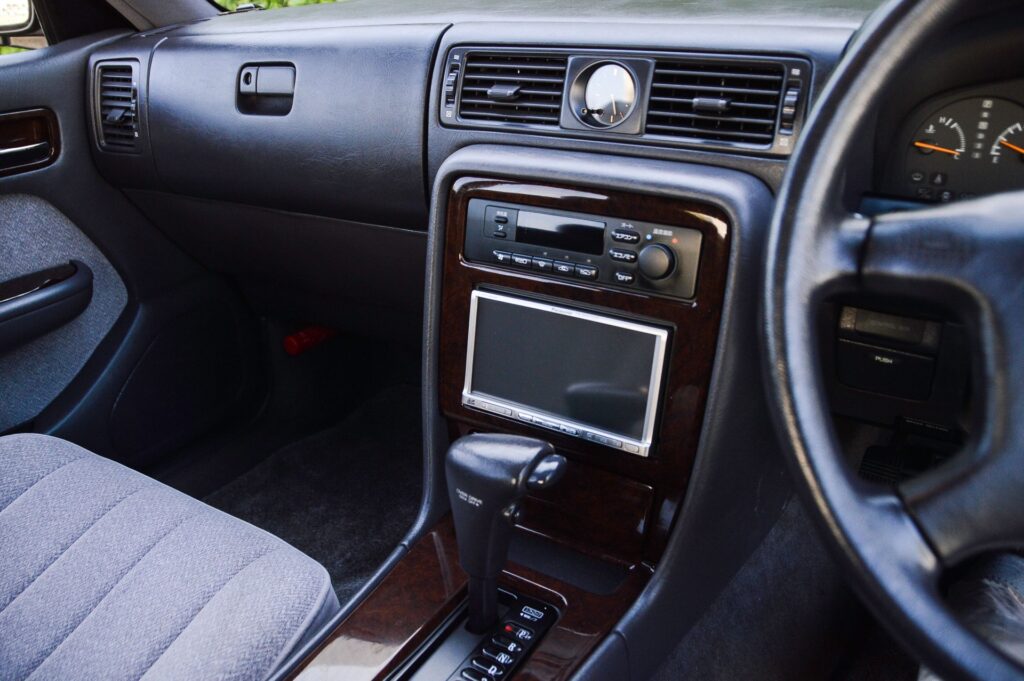 Black 1995 Nissan Gloria sedan interior car audio