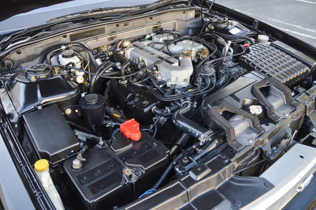 Black 1995 Nissan Gloria sedan engine bay