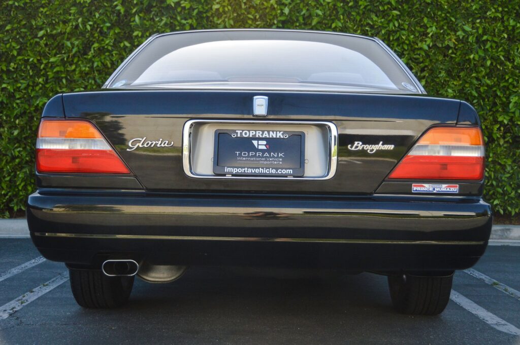 Black 1995 Nissan Gloria sedan rear view
