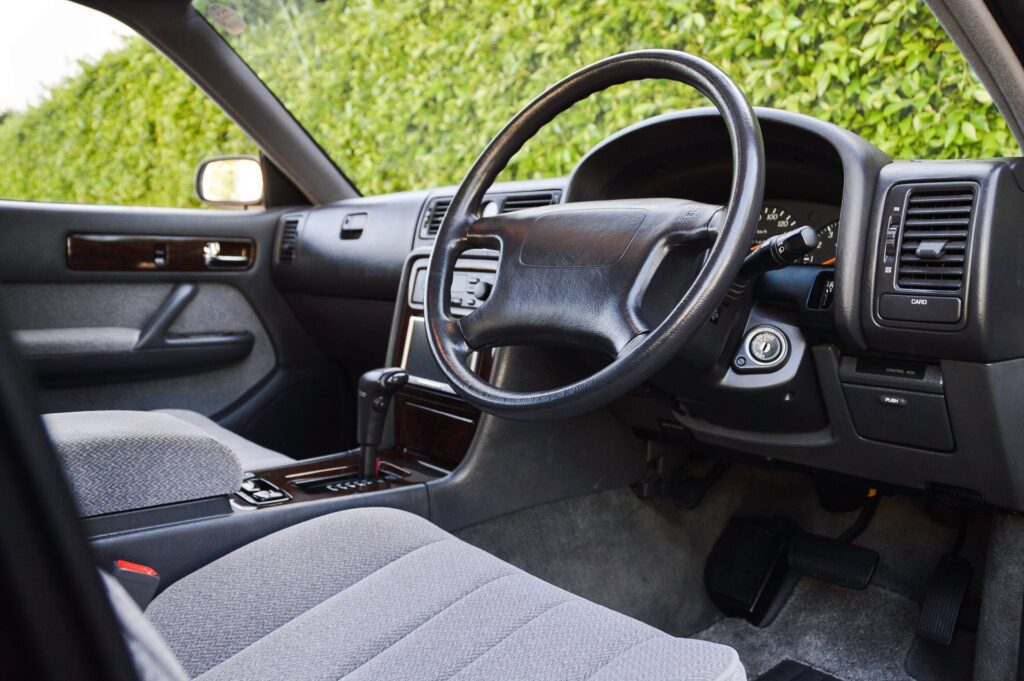 Black 1995 Nissan Gloria sedan interior right hand drive