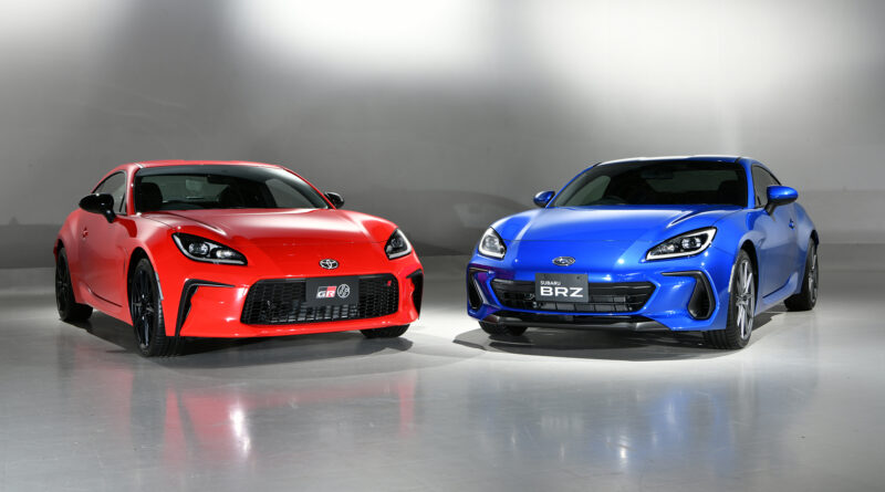 2022 Toyota GR 86 (red) next to the 2022 Subaru BRZ (blue)