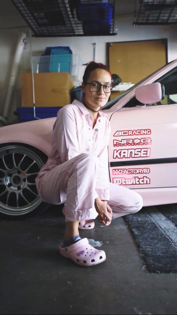 Caitlin Ting with her pink BMW E36 drift car. Photo by Drew Fishbien