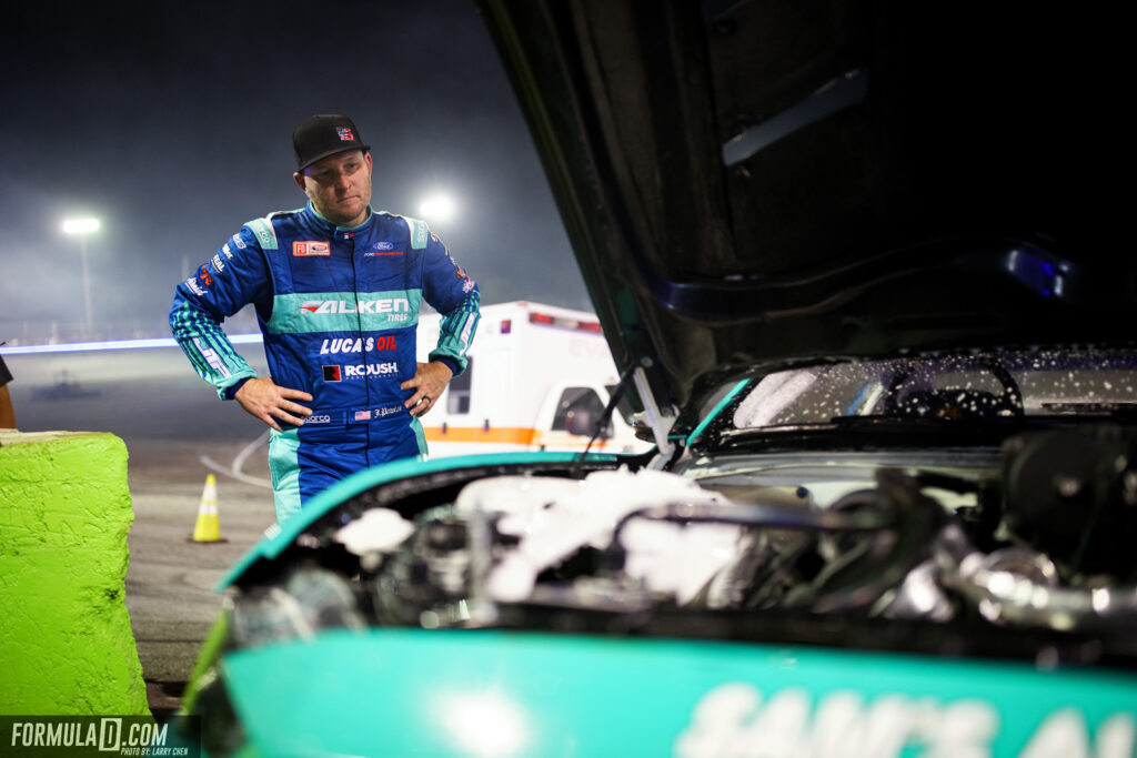 Formula Drift 2021 Round 2 Orlando. Justin Pawlak looks at his fire damaged engine