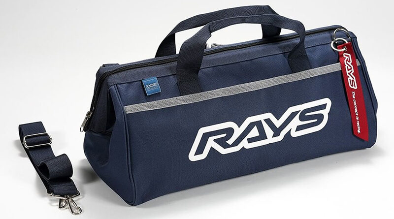 RAYS Engineering tool bag in navy blue. Shown with detachable shoulder strap and red RAYS logo jet tag
