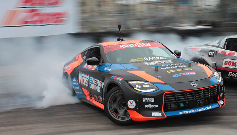 Chris Forsberg's 2023 Nissan Z drift car sliding around a corner