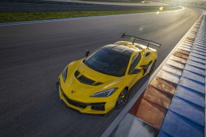 Front aerial shot of the Chevrolet Corvette ZR1 coupe in Competition Yellow with optional ZTK Performance Package on the race track. Preproduction model shown. Actual production model may vary.