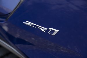 Close-up view of ZR1 badge on a Chevrolet Corvette ZR1 Convertible in Hysteria. Preproduction model shown. Actual production model may vary.