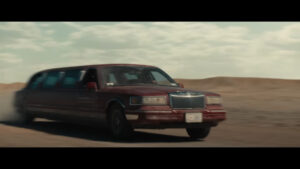 A dark red 1990s Lincoln Town Car Limo as seen in the trailer for Marvel Studios Thunderbolts*