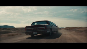 A dark red 1990s Lincoln Town Car Limo as seen in the trailer for Marvel Studios Thunderbolts*