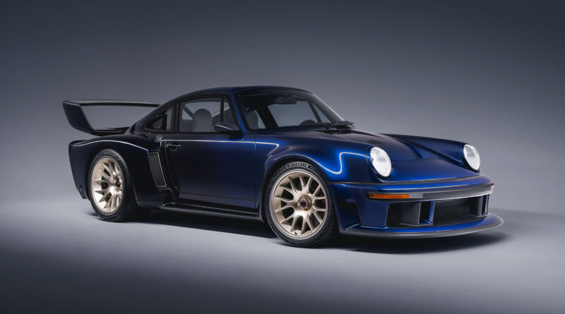 front ¾ view of the Sorcerer DLS Turbo commission, specified by its owner with track-focused carbon fiber bodywork is presented in graduated Fantasia Blue with seven-spoke magnesium wheels in Champagne.