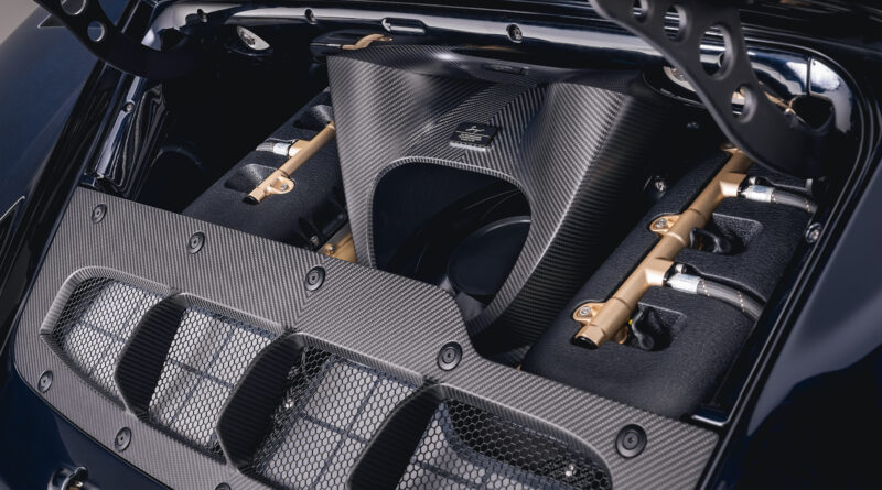 Engine bay view. The 3.8l twin-turbocharged flat-six now delivers 710 HP (SAE net) with a redline above 9000 rpm. The horizontally mounted cooling fan can be seen atop the engine block.